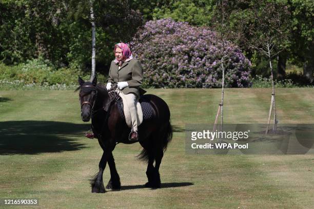 Issue date: Sunday May 31, Queen Elizabeth II rides Balmoral Fern, a 14-year-old Fell Pony, in Windsor Home Park over the weekend of May 30 and May...