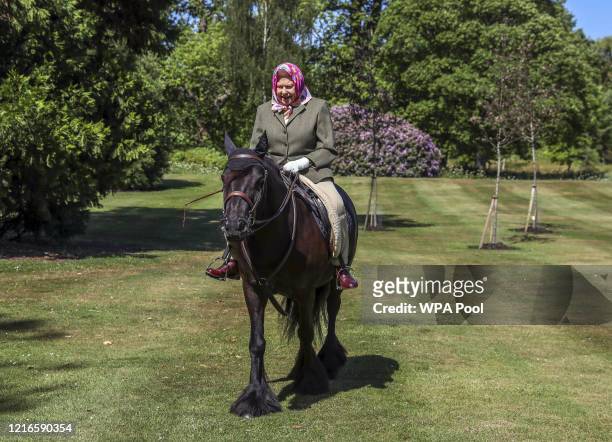 Issue date: Sunday May 31, Queen Elizabeth II rides Balmoral Fern, a 14-year-old Fell Pony, in Windsor Home Park over the weekend of May 30 and May...