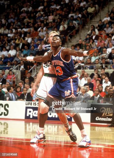 New York Knick center Patrick Ewing, right, boxes out the Boston Celtics Larry Bird after a free throw, during a game in Hartford, Connecticut, 1988.