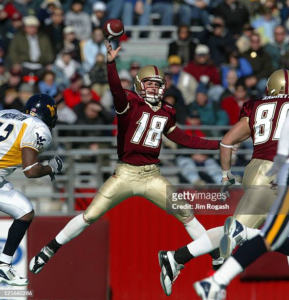 Boston College quarterback Paul Peterson, attempts to defy gravity as he looks for an open man against West Virginia during a game between the Boston...