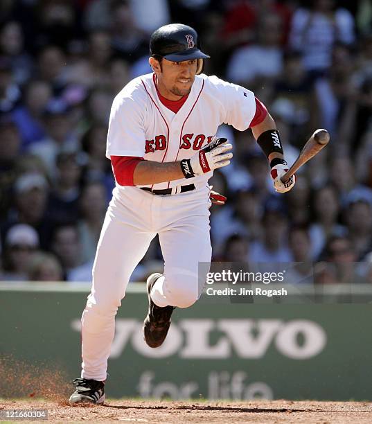 Boston Red Sox batter Nomar Garciaparra runs out a chopper to the mound against the Los Angeles Dodgers at Fenway Park in Boston, Massachusetts on...