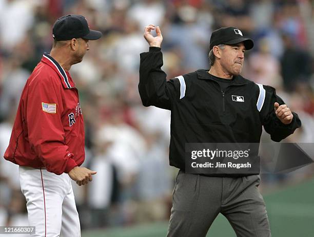 Boston Red Sox manager Terry Francona, left, is thrown out after argueing a call with umpire Mike Winters in a game against the New York Yankees at...