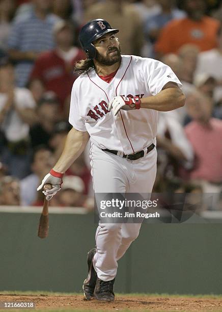 Boston Red Sox batter Johnny Damon watches the flight of his secon home run against the Texas Rangers Friday, July 9, 2004. The Red Sox won 7-0 at...