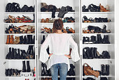 Woman cleaning shoes closet