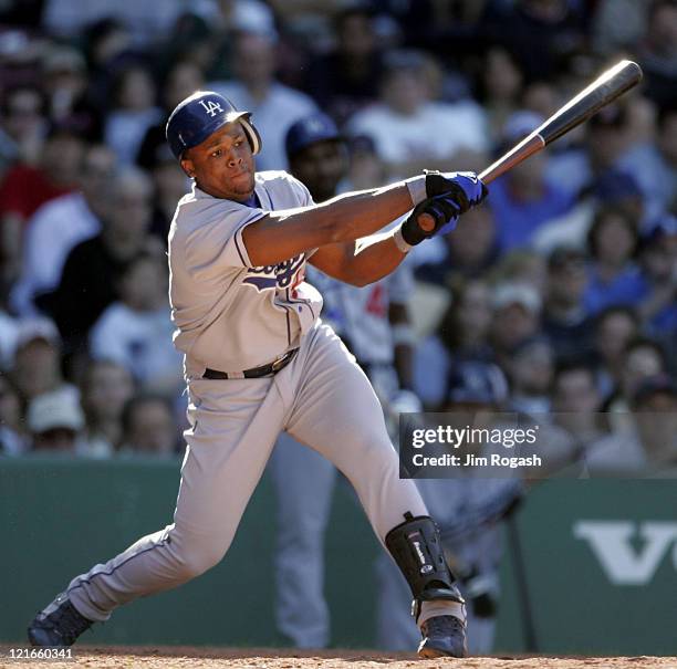 Against the Boston Red Sox, Los Angeles Dodgers' Milton Bradley takes a cut at Fenway Park in Boston, Massachusetts on June 12, 2004.