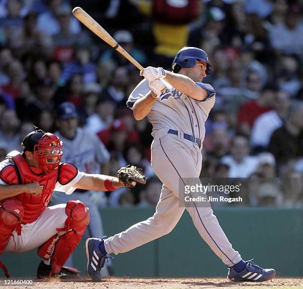 Against the Boston Red Sox, Los Angeles Dodgers batter Paul Lo Duca connects at Fenway Park in Boston, Massachusetts on June 12, 2004.