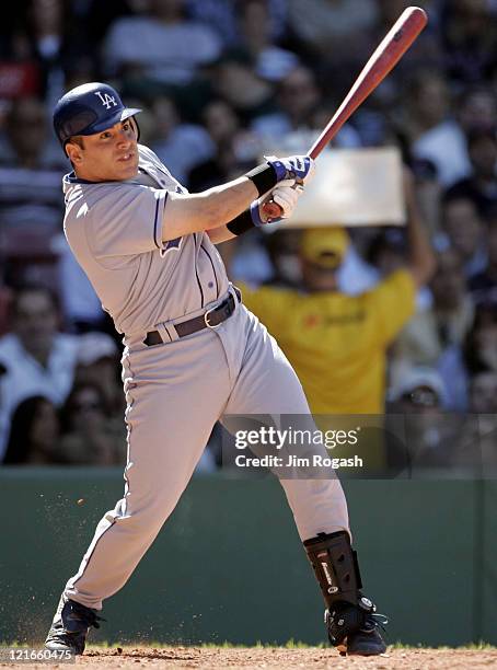 Against the Boston Red Sox, Los Angeles Dodgers batter Paul Lo Duca connects at Fenway Park in Boston, Massachusetts on June 12, 2004.