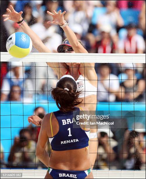 Kerri Walsh of the United States tries to block a spike from Renata Ribeiro of Brazil during their beach volleyball Women's Semifinal at the Chaoyang...