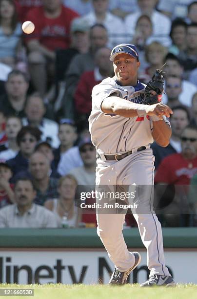 Against the Boston Red Sox, Los Angeles Dodgers third baseman Adrian Beltre makes the long throw for the put- out at Fenway Park in Boston,...