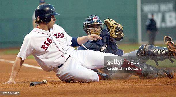 Boston Red Sox base runner Mark Bellhorn scores on Cleveland Indians catcher Tim Laker in the first inning at Fenway Park in Boston, Wednesday, May...