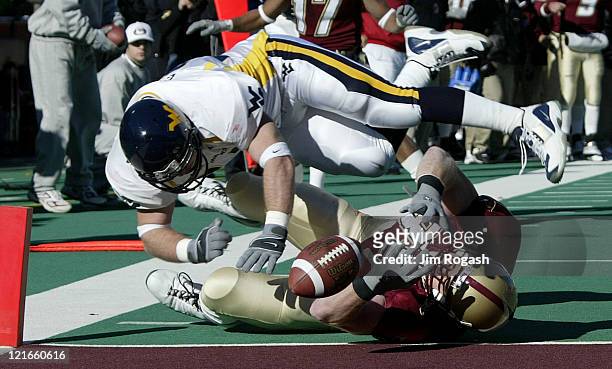 After catching a pass to advance to the one yard line, Boston College tight end Sean Ryan, bottom, is prevented from scoring by the defense of West...