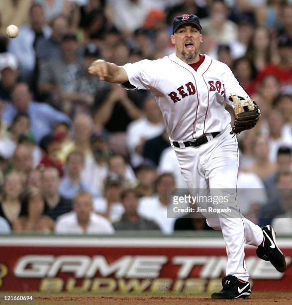 Boston Red Sox third baseman Bill Mueller makes the throw to first against the New York Yankees at Fenway Park in Boston, Massachuesetts on July 23,...