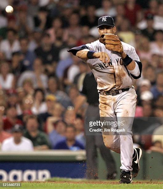 Against the Boston Red Sox, New York Yankees third baseman Alex Rodriguez makes the throw to first at Fenway Park in Boston, Massachuesetts on July...