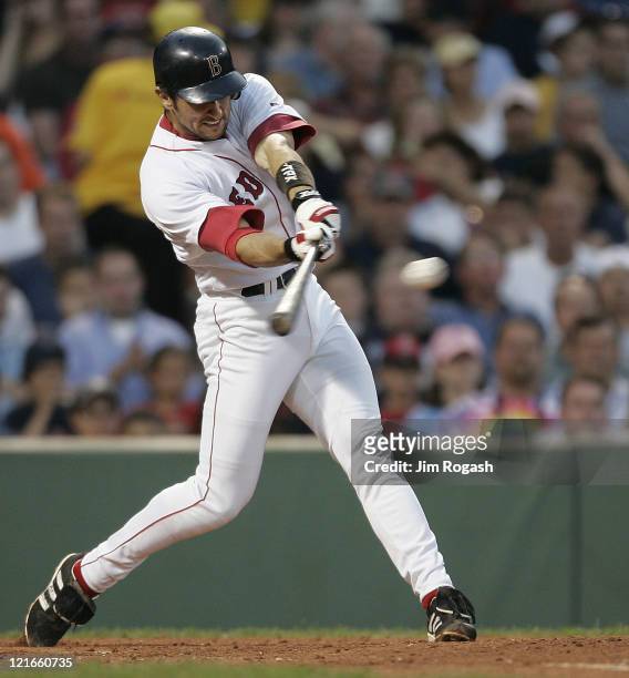 Boston Red Sox batter Nomar Garciaparra makes contact against the Texas Rangers Friday, July 9, 2004. The Red Sox won 7-0 at Fenway Park in Boston.