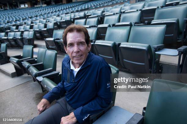 Portrait of American former baseball player, All-Star pitcher, and White Sox Broadcaster Ed Farmer as he sits in the stands at Comiskey Park,...