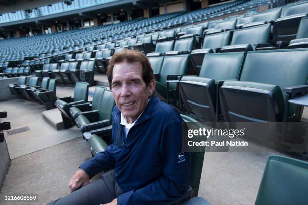 Portrait of American former baseball player, All-Star pitcher, and White Sox Broadcaster Ed Farmer as he sits in the stands at Comiskey Park,...