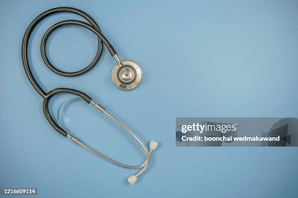 black stethoscope. healthcare. - stethoskop stock-fotos und bilder
