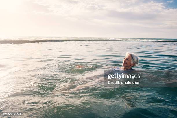 i'm floating away to paradise - sea swimming stock pictures, royalty-free photos & images