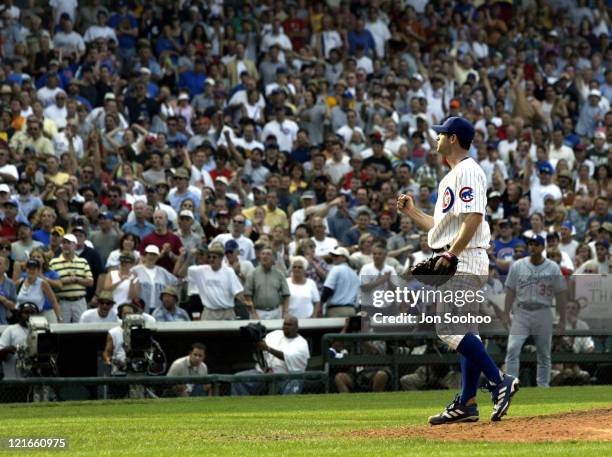 Cubs' starting pitcher Mark Prior pumps his fist after throwing completer game.