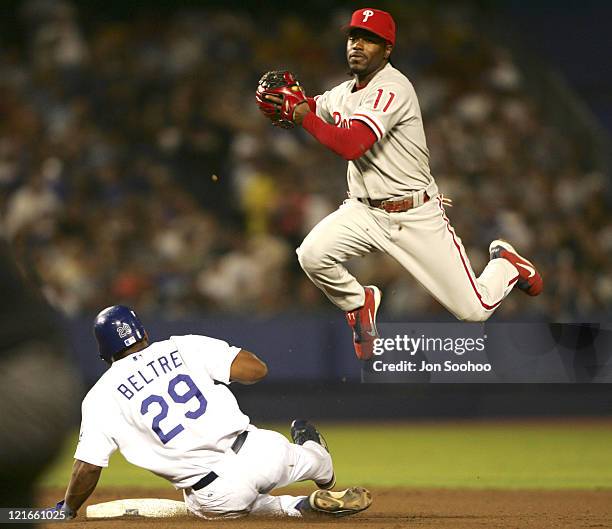 Philadelphia Phillies Jimmy Rollins can't turn to as Los Angeles Dodgers Adrian Beltre slides into second at Dodger Stadium.