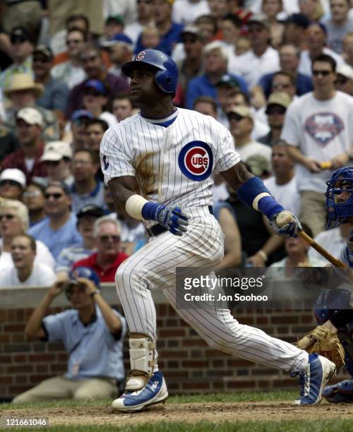 Cubs' Sammy Sosa RBI's in the first inning after hitting double.