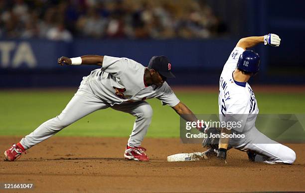 St. Louis Cardinals shortstop Edgar Renteria tags out Los Angeles Dodgers runner Steve Finley in the first inning Friday, September 10, 2004. The...