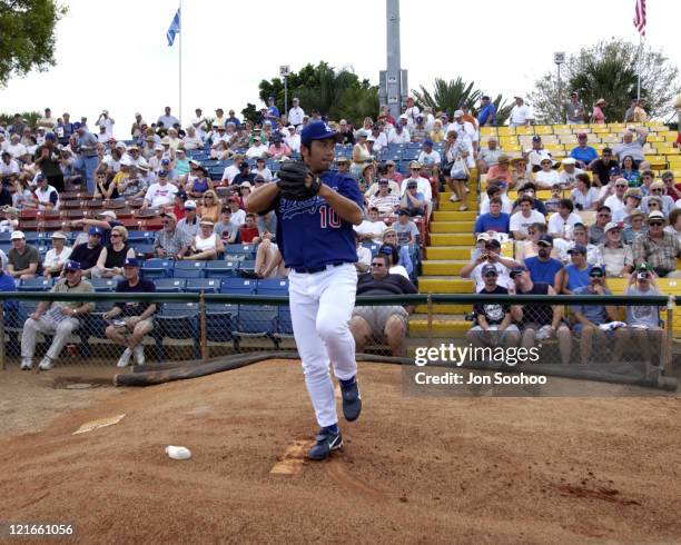 Los Angeles Dodger Hideo Nomo warming up prior to game vs. St. Louis Cardinals at Dodgertown,Vero Beach, Florida.