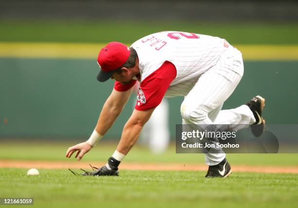 Cincinnati Reds' Sean Casey can't come up with Los Angeles Dodgers' Cesar Izturis bunt in the fifth inning Thursday, August 12, 2004 at Great...