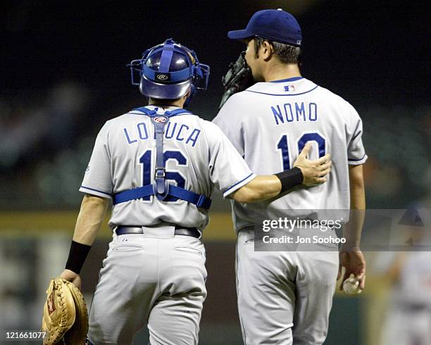 Dodgers catcher Paul Loduca consoles starting pitcher Hideo Nomo in the first inning after giving up four runs to the Astros