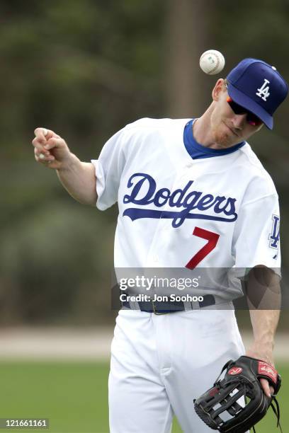 Los Angeles Dodgers outfielder J.D. Drew avoids getting hit by the ball during the first full squad workout at Dodgertown in Vero Beach, Florida on...