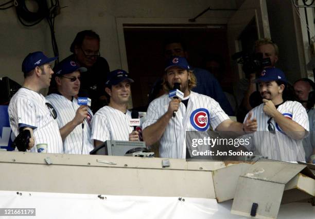 Actor Russell Crowe sings "Take Me Out to the Ballgame" to the crowd at Wrigley Field during the 7th inning.