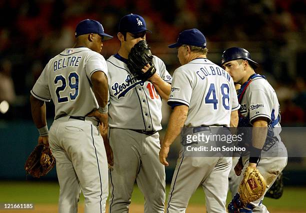 Dodgers starter Hideo Nomo talks to pitching coach Jim Colborn in the 6th inning.