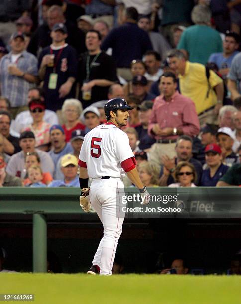 Boston Red Sox's Nomar Garciaparra fwalks back to the dugout during a game against the San Diego Padres in Fenway Park June 9, 2004.