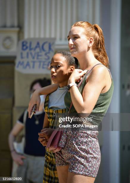 Woman comforts a young girl during the demonstration. Hundreds attend a Black Lives Matter protest in Manchester's city centre in support against the...