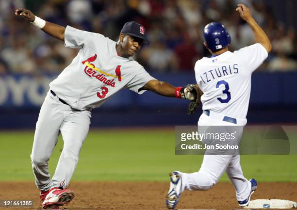 Los Angeles Dodgers Cesar Izturis, steals second base in the third inning as St. Louis Cardinals Edgar Renteria fails to make the tag Friday,...