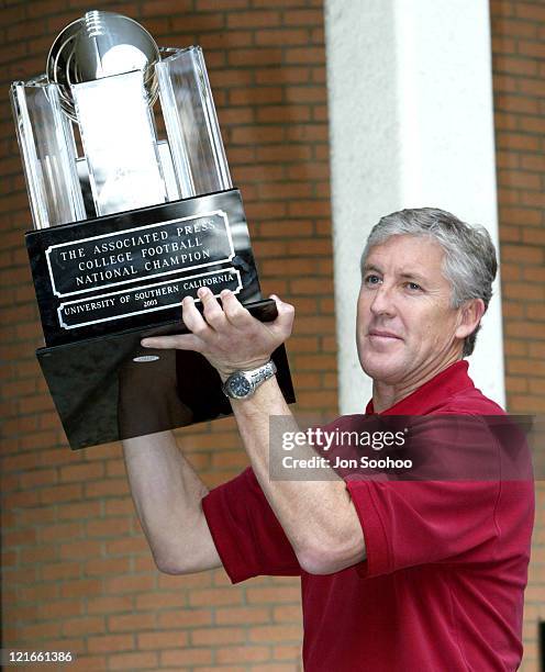 The Associated Press 2003 College Football National Championship trophy is presented to head coach Pete Carroll of the University of Southern...