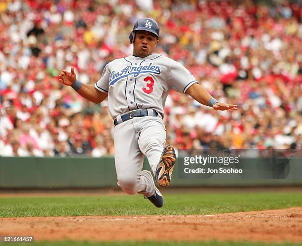 Los Angeles Dodgers' shortstop Cesar Izturis scores from second base off teammate Adrian Beltre's double in the fifth inning against the Cincinnati...