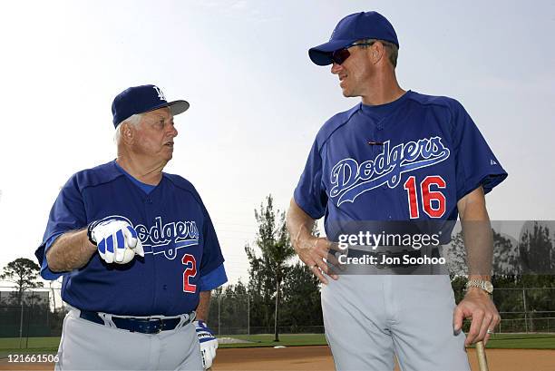 Los Angeles Dodgers Hall of Fame Manager Tom Lasorda speaks with current Dodgers Manager Jim Tracy during workouts at Dodgertown in Vero Beach,...