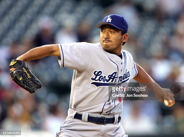 Los Angeles Dodgers Kazuhisa Ishii gives up a home run to Colorado Rockies Todd Helton in the third inning at Coors Field in Denver, Colorado on July...