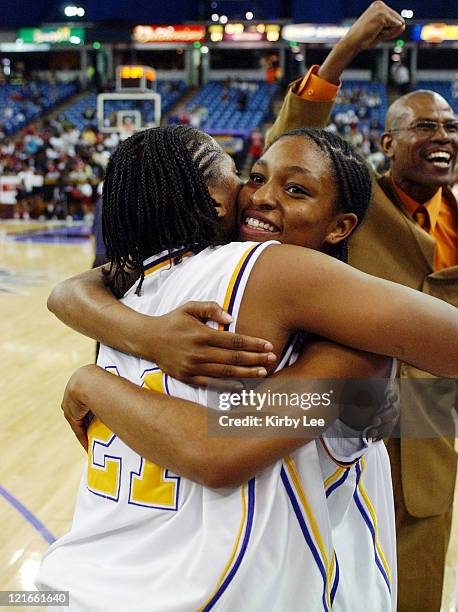 Janine Jackson and Alexis Gray-Lawson of Oakland Tech embrace during the CIF State Division I Girls Basketball final against Canyon Springs at the...