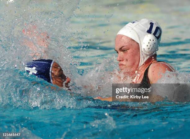 Christine Robinson of Canada defends against Italy's Silivia Bosguri in the International Holiday Cup at the USA Water Polo National Training Center...