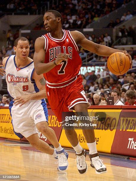 Ben Gordon of the Chicago Bulls dribbles past a defender during the NBA game between the Los Angeles Clippers and the Chicago Bulls at the Staples...