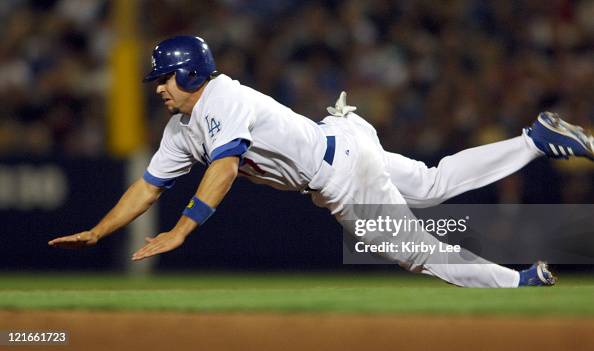 Jason Repko Jason Repko of the Los Angeles dives toward second base in the fifth ...