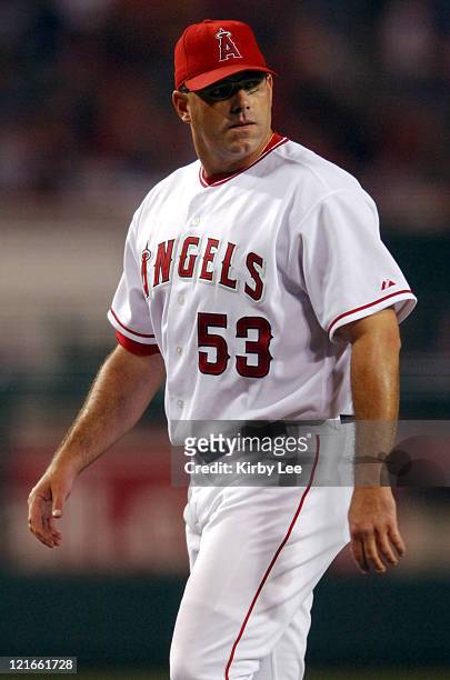 Los Angeles Angels of Anaheim reliever Brendan Donnelly walks off the field after he was ejected and his glove was confiscated by umpires because of...