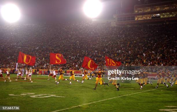 Players run onto the field before the start of the second half of 28-21 victory over Arizona State in Pacific-10 Conference game for the Trojans'...