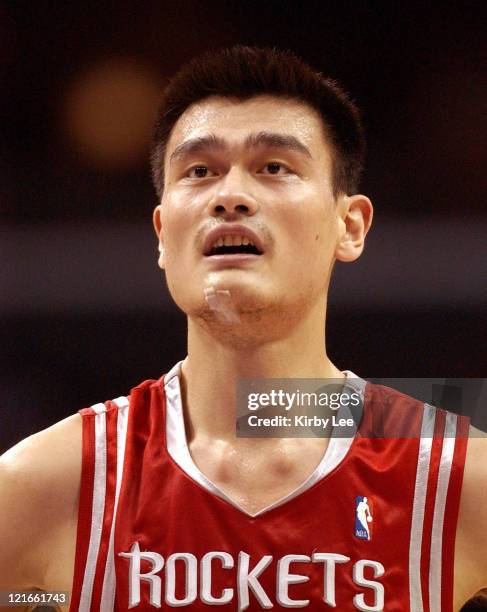 Yao Ming of the Houston Rockets walks onto the court during the NBA game between the Los Angeles Lakers and the Houston Rockets at the Staples Center...