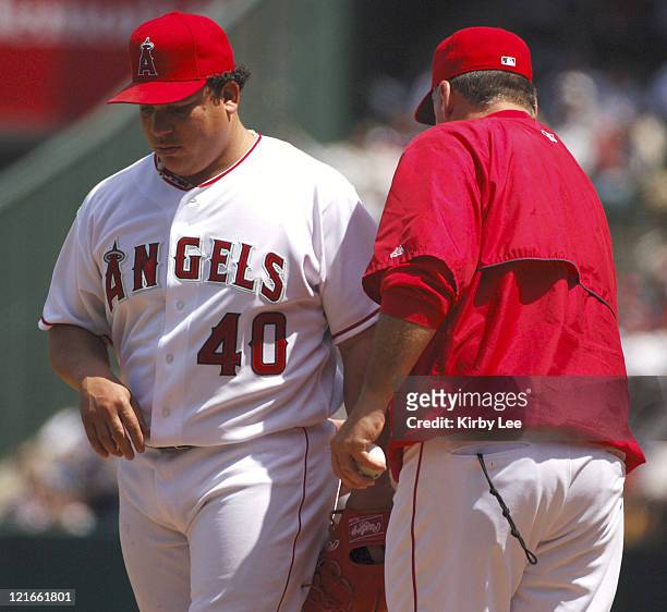 Los Angeles Angels of Anaheim starter Bartolo Colon is removed by manager Mike Scioscia in the third inning of 10-1 loss to the New York Yankees at...