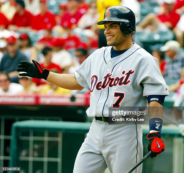 Ivan Rodriguez of the Detroit Tigers waits at home plate to greet Brandon Inge after a leadoff home run in 10-1 victory over the Los Angeles Angels...