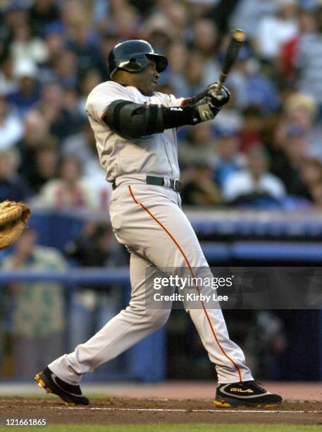 Barry Bonds of the San Francisco Giants hits his 678th career home run and 20th home run of the season on a three-run homer in the third inning...