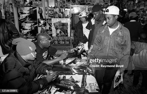 Rapper King Tee signs autographs at George's Music Room in Chicago, Illinois in May 1995.